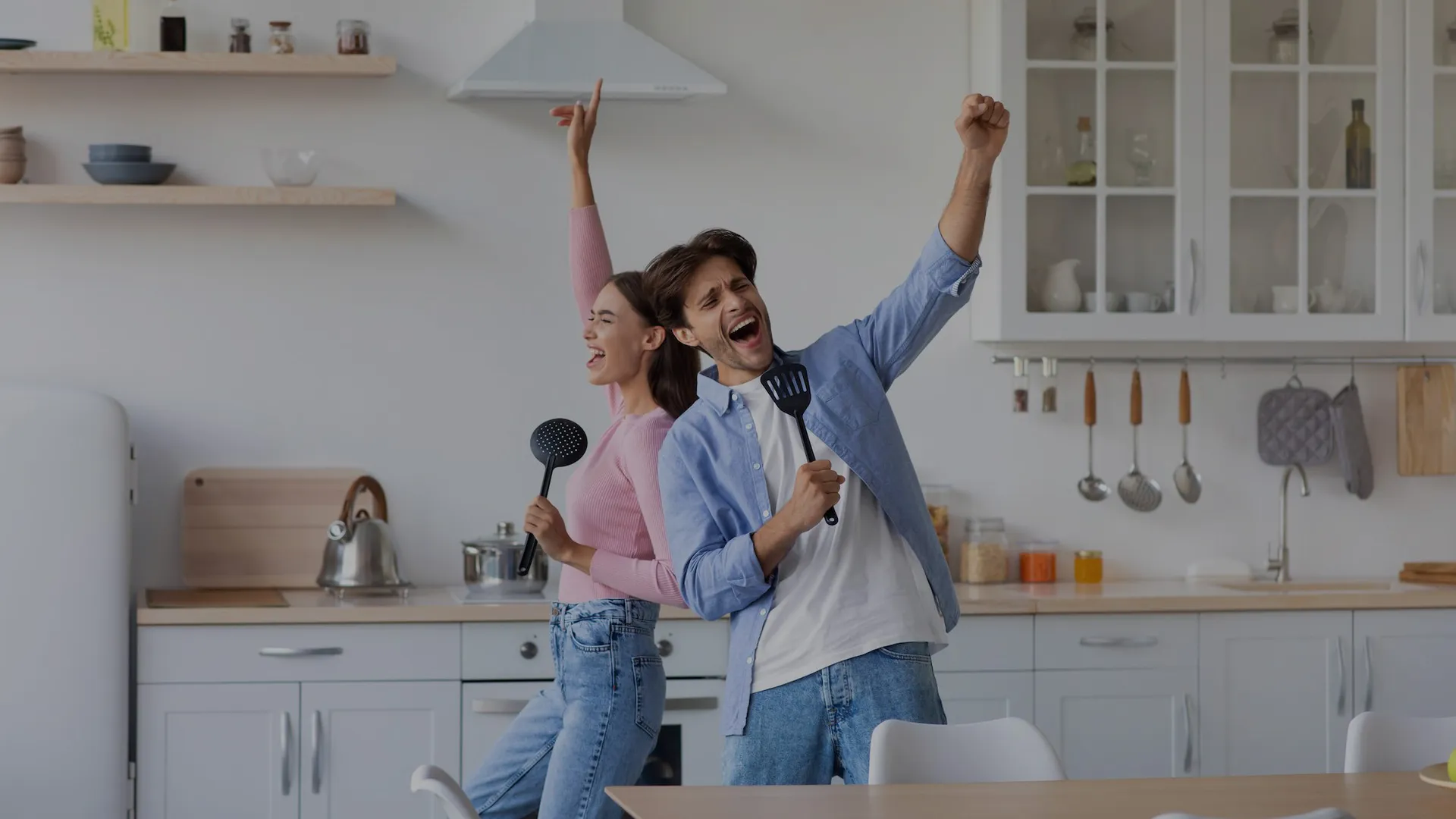 happy-excited-man-and-woman-sing