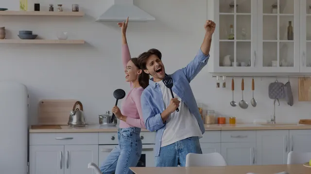 happy-excited-man-and-woman-sing